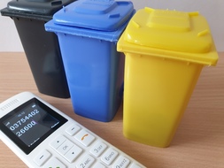 Bild Telefon und Tonnen